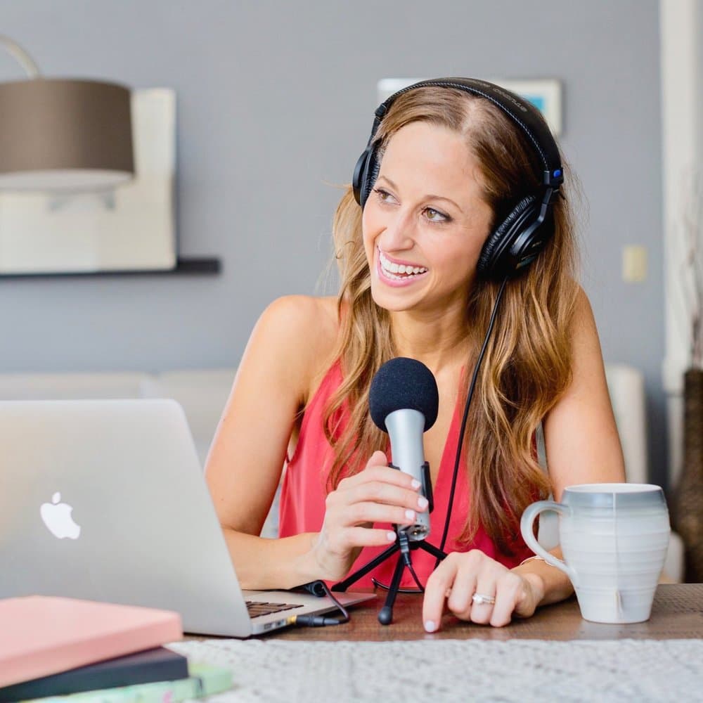 Erica Mandy recording her podcast